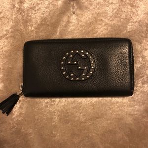 Gucci zip wallet with silver studs.